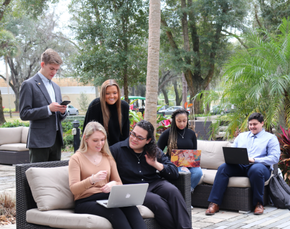 Prelaw and Preprofessional students sitting on the lawn  